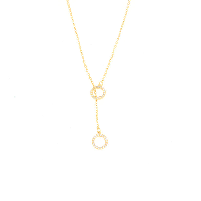 Gold-toned Y-drop necklace with two round, pavé-set crystal embellished elements on a delicate chain.