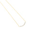 Gold-toned fine link chain necklace with a curved bar pendant set with a row of clear, round, faceted stones.