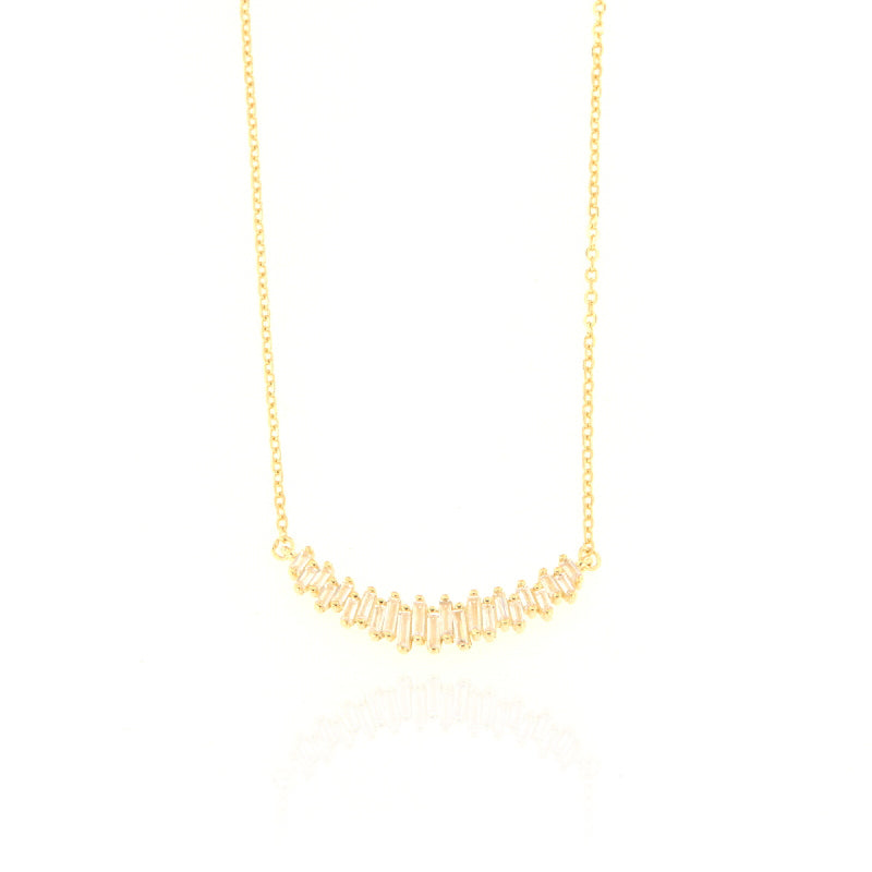 Gold-toned delicate chain necklace with a curved pendant featuring multiple clear baguette-cut stones