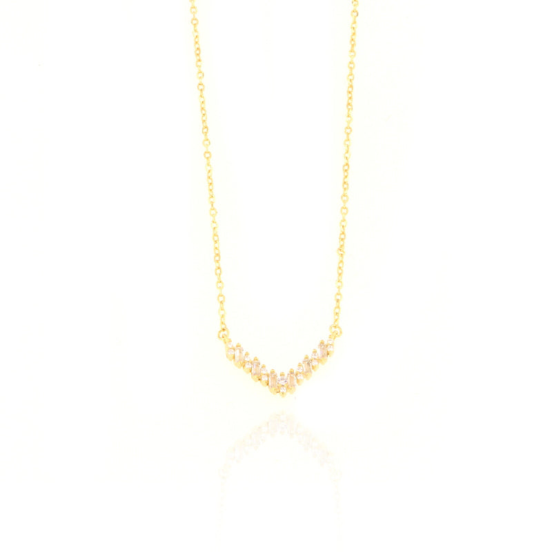 Gold-toned fine link chain necklace with a curved pendant featuring clear rectangular and round-cut stones.