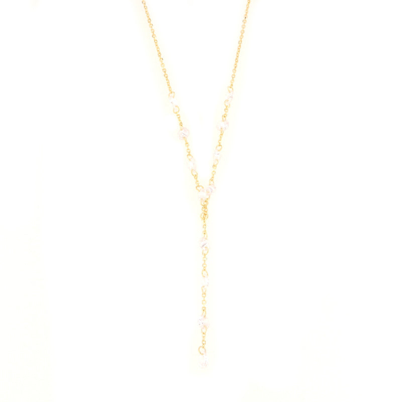 Gold-toned Y-shape lariat necklace with clear, faceted crystal-like beads spaced along the delicate chain.