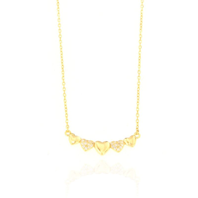 Gold-toned chain necklace with five heart charms, three plain and two embellished with clear stones.