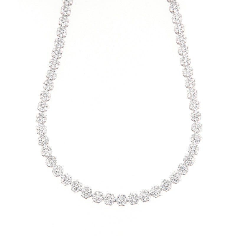 Silver-toned necklace featuring a continuous strand of circular clusters, each set with multiple clear, sparkling stones.