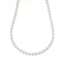 Silver-toned necklace featuring a continuous strand of circular clusters, each set with multiple clear, sparkling stones.