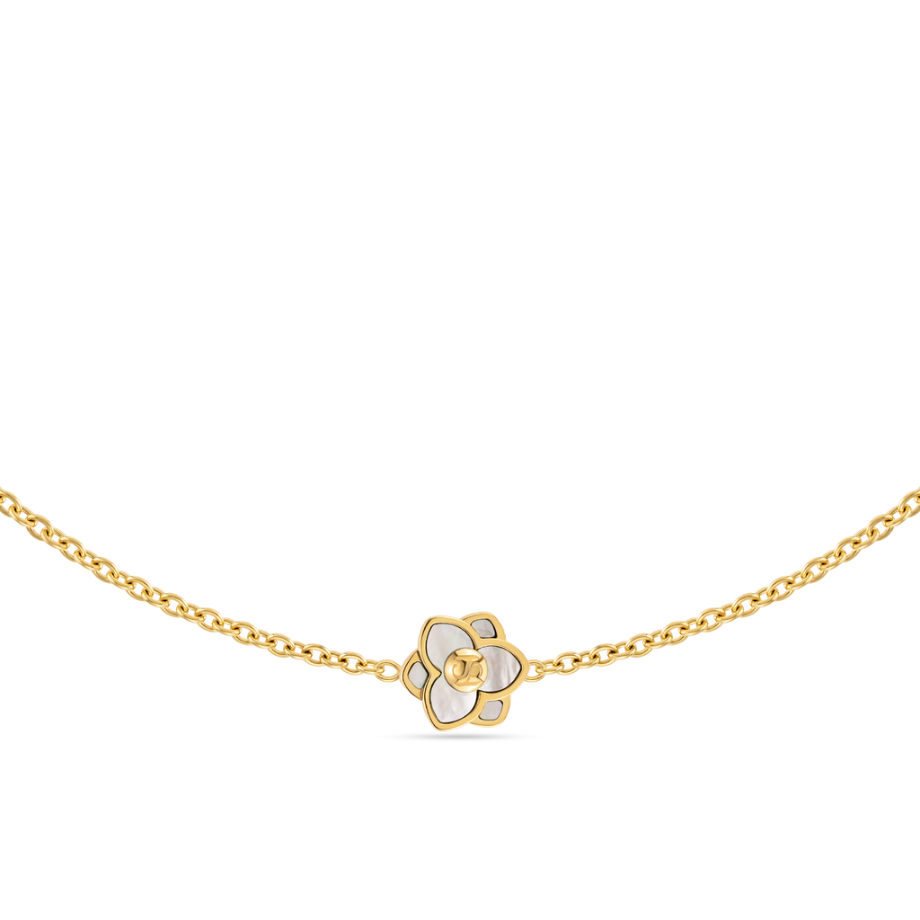 Gold-toned long chain necklace with a white mother of pearl flower pendant featuring a gold-toned interlocking letter logo.