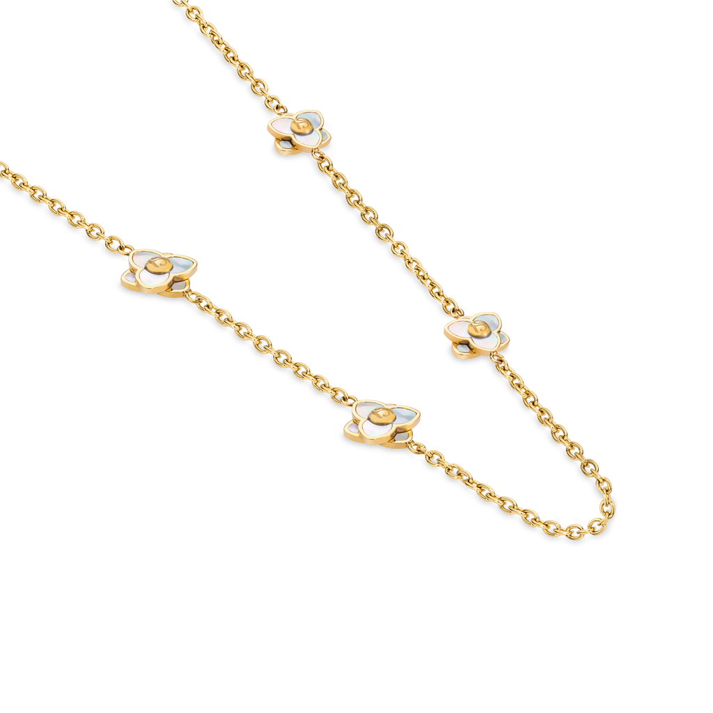 Long gold-toned chain necklace with four white iridescent mother-of-pearl flower motifs, each with a gold-toned center bead.