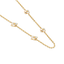 Long gold-toned chain necklace with four white iridescent mother-of-pearl flower motifs, each with a gold-toned center bead.