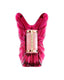 A top-down view of the Carolina Herrera Lucky Charms "La Bomba" Eau de Parfum bottle, featuring a vibrant magenta glass flacon shaped like stylized butterfly wings with a central cylindrical pink marble-effect cap accented in gold.