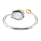 An angled rear view of the Aigner Flora S timepiece showcasing the engraved stainless steel horseshoe case back detailed with technical specs, the textured background engraving, the fluted yellow gold crown, and the open torque bypass bangle structure.