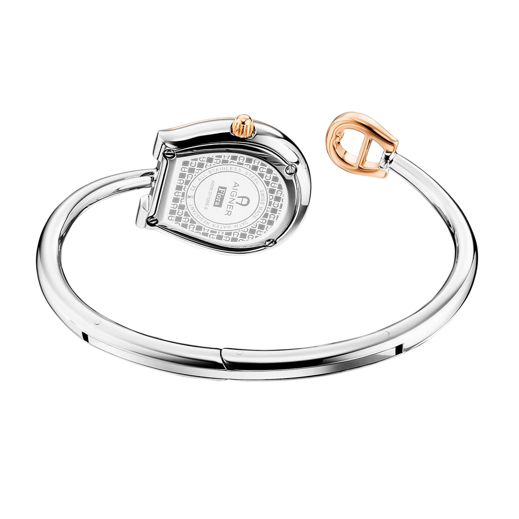 A rear angle perspective highlighting the polished stainless steel caseback engraved with the model number AGW271005S and Flora collection name, alongside the inner curve of the open bangle bracelet and the contrasting rose gold crown.
