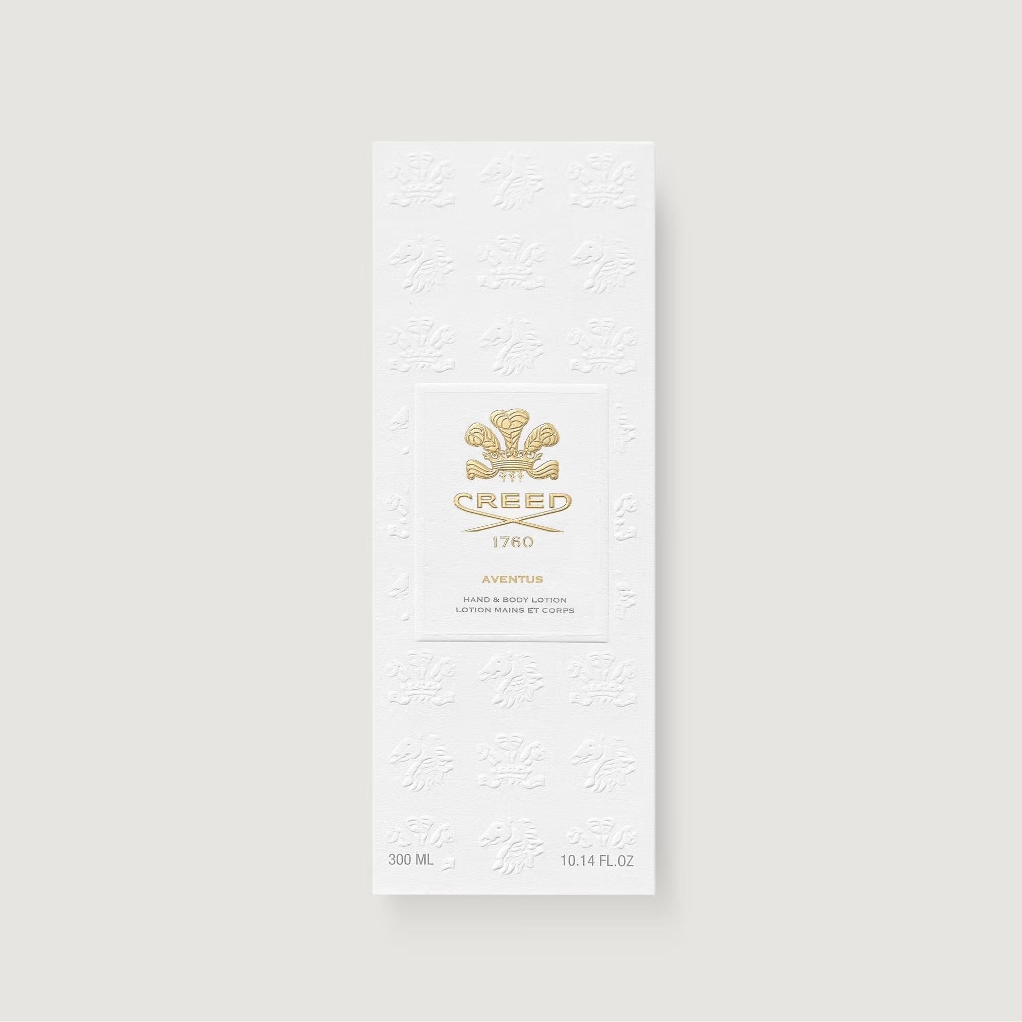 White rectangular box with embossed crest patterns. A central panel features a gold-toned crest and "CREED 1760".