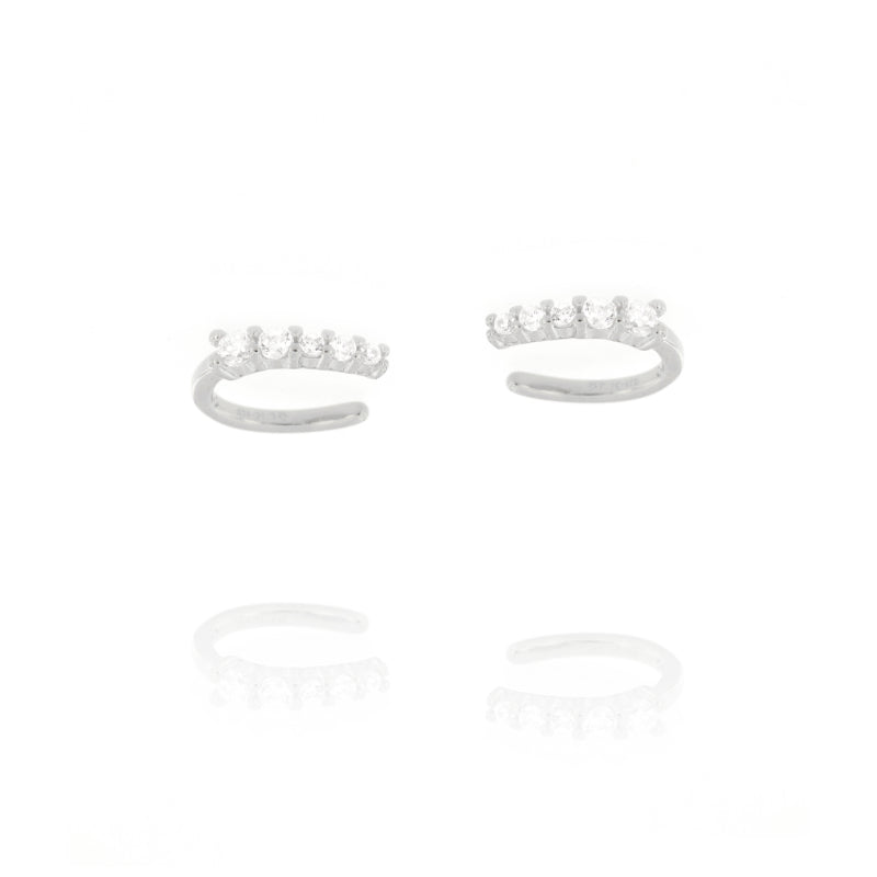 Pair of silver-toned open-hoop ear cuffs, each adorned with five clear, round, brilliant-cut stones.