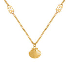 Gold-toned chain necklace with a ribbed scallop shell pendant and two rectangular logo elements integrated into the chain.