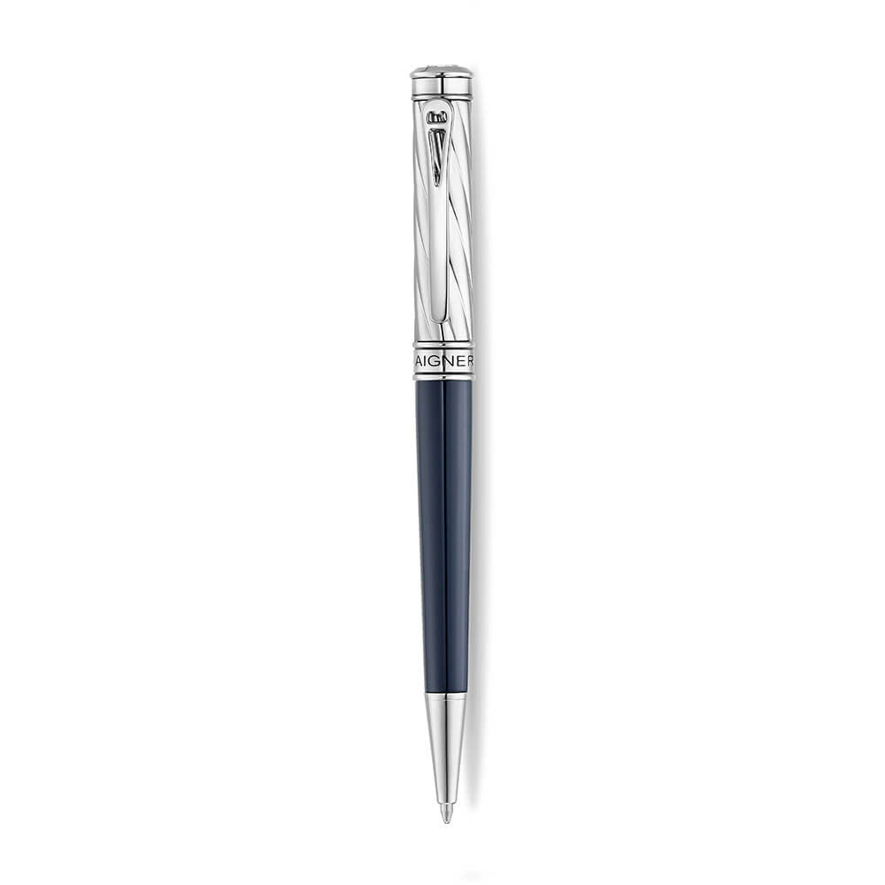 A high-resolution studio presentation of the Aigner Modeno Due men's luxury ballpoint pen displayed horizontally against a white background, highlighting its brass barrel finished with a smooth midnight-blue lower grip, a silver-tone cap engraved with diagonal spiraling grooves, a vertical Aigner logo on the central silver band, a sleek pocket clip, and the exposed fine writing tip.