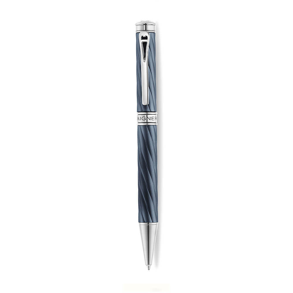 A high-resolution studio presentation of the Aigner Modeno Due men's luxury ballpoint pen displayed horizontally, highlighting its brass barrel finished in an engraved, spiraling blue-grey fluted pattern, the central silver band with a vertical Aigner logo, a sleek chrome pocket clip, and the exposed fine silver writing cone.