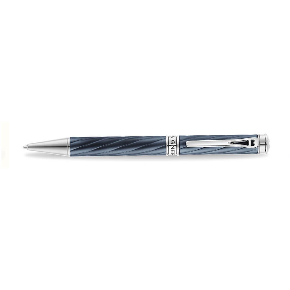 A high-resolution studio presentation of the Aigner Modeno Due men's luxury ballpoint pen displayed horizontally, highlighting its brass barrel finished in an engraved, spiraling blue-grey fluted pattern, the central silver band with a vertical Aigner logo, a sleek chrome pocket clip, and the exposed fine silver writing cone.