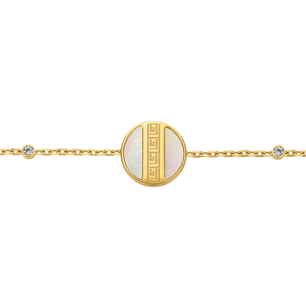 Gold-toned chain bracelet with a circular mother-of-pearl charm and a gold-toned Greek key pattern. Small clear crystals on t