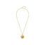 Gold-toned necklace with a round pendant featuring a raised lion's head and a white mother-of-pearl-like rim with Greek key p