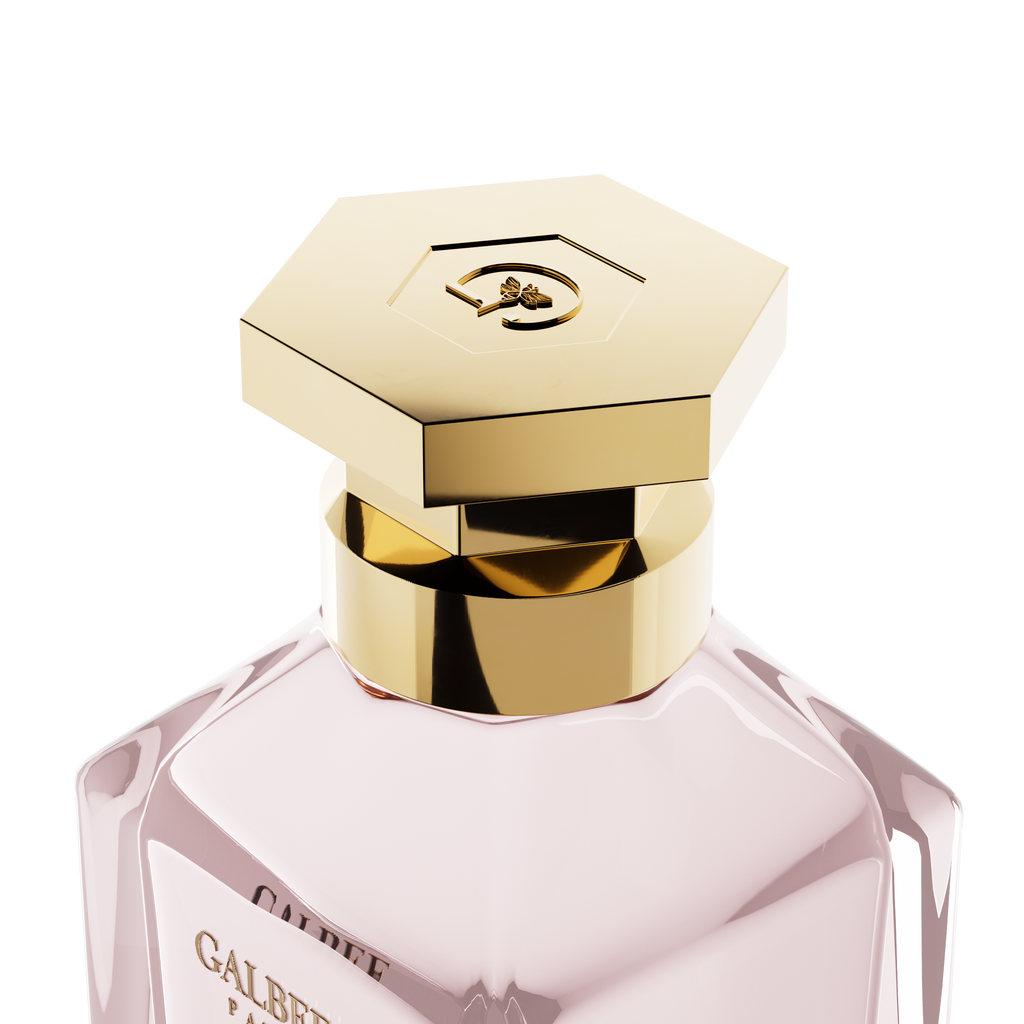 A close-up detail shot of the golden hexagonal cap on the Galbee Paris bottle, showcasing the delicate bee engraving on the top surface.