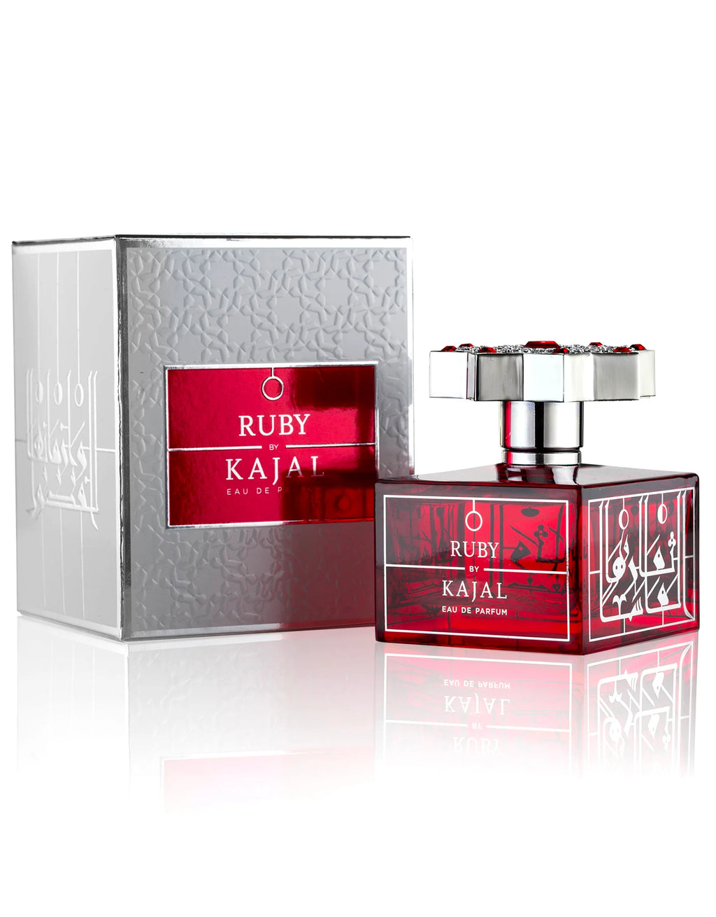 The Kajal Ruby Eau De Parfum bottle presented alongside its textured silver and red metallic packaging.