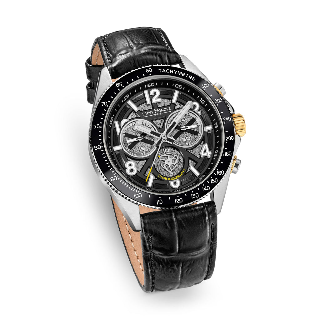Black crocodile-embossed leather strap watch with a silver-toned case, black bezel, and black dial with three silver-toned su