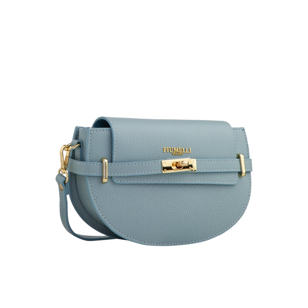 Light blue pebbled leather half-moon bag with a flap closure, gold-toned turn-lock, 'PIUMELLI MILANO' branding, and adjustabl