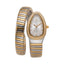 Monteva ladies' watch with an elongated silver-toned case, gold-toned stone-set bezel, and a two-tone gold and silver coiled