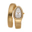 Gold-toned Monteva ladies' watch with an oval case, a bezel set with clear stones, and a flexible coiled bracelet.