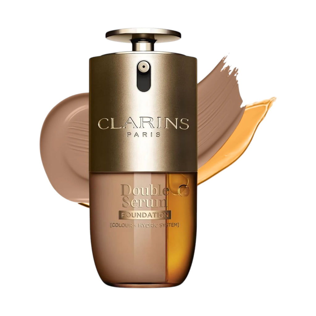 Clarins Double Serum Foundation bottle with a gold-toned pump and clear body, revealing two liquids: light brown and amber.