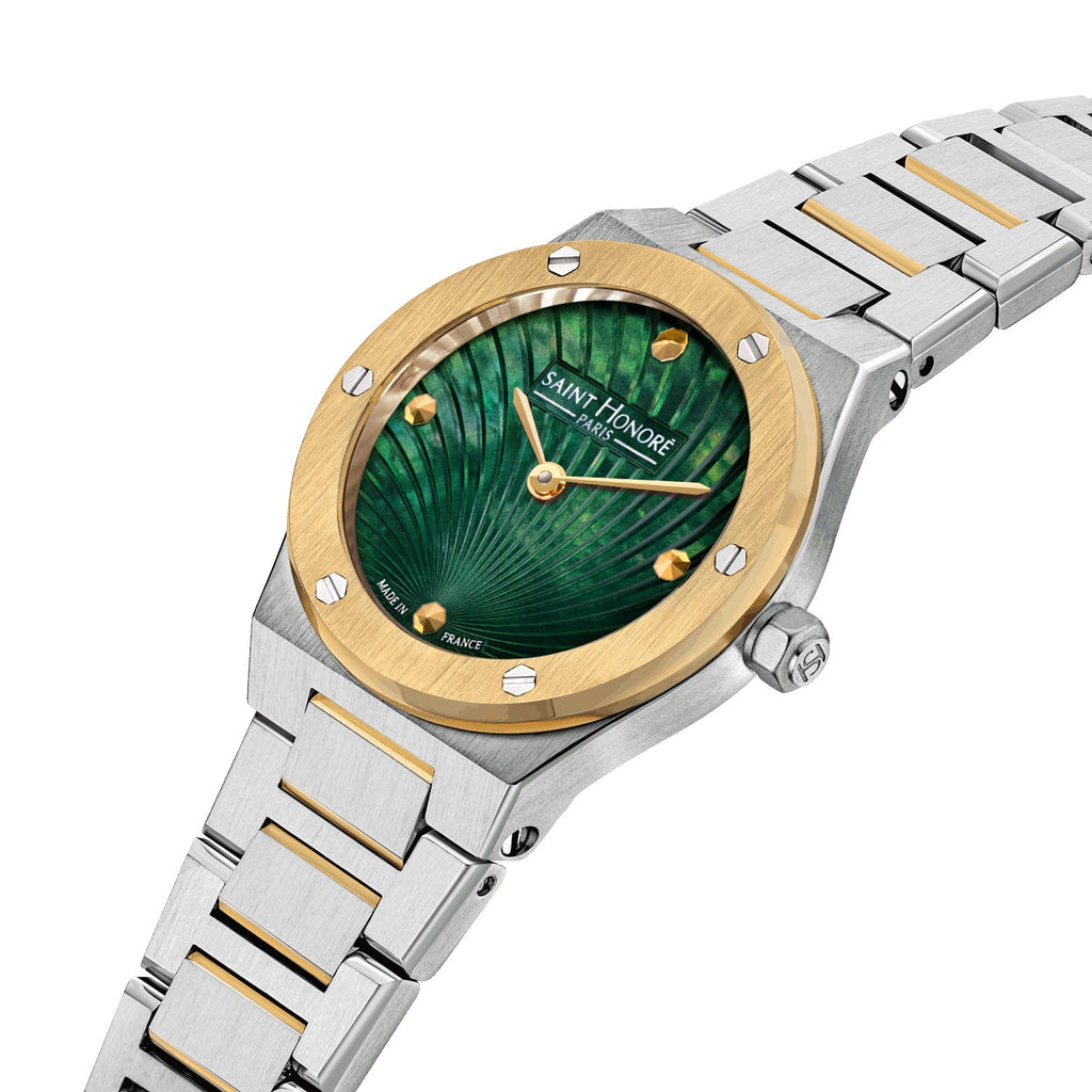 Two-toned watch with a stainless steel case, gold-toned bezel, and green fan-patterned dial with gold-toned markers and hands