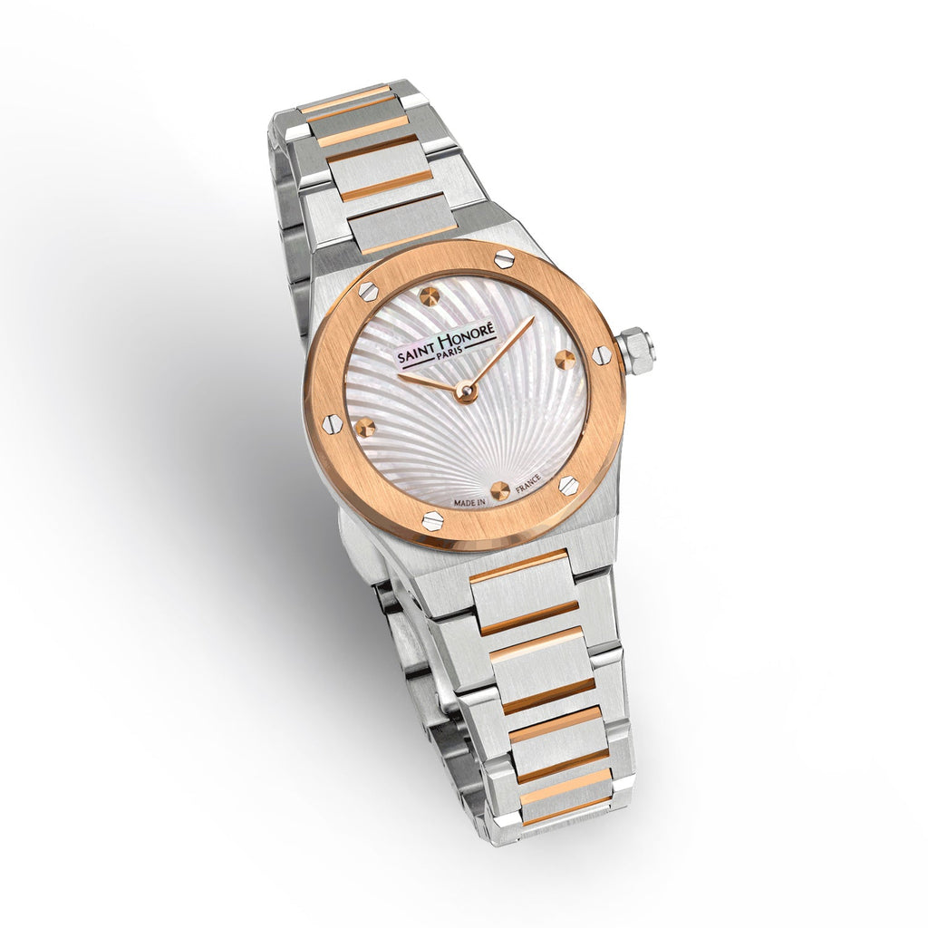 Two-toned watch with silver-toned case, rose gold-toned bezel with screws, white mother-of-pearl fan dial, and two-toned meta