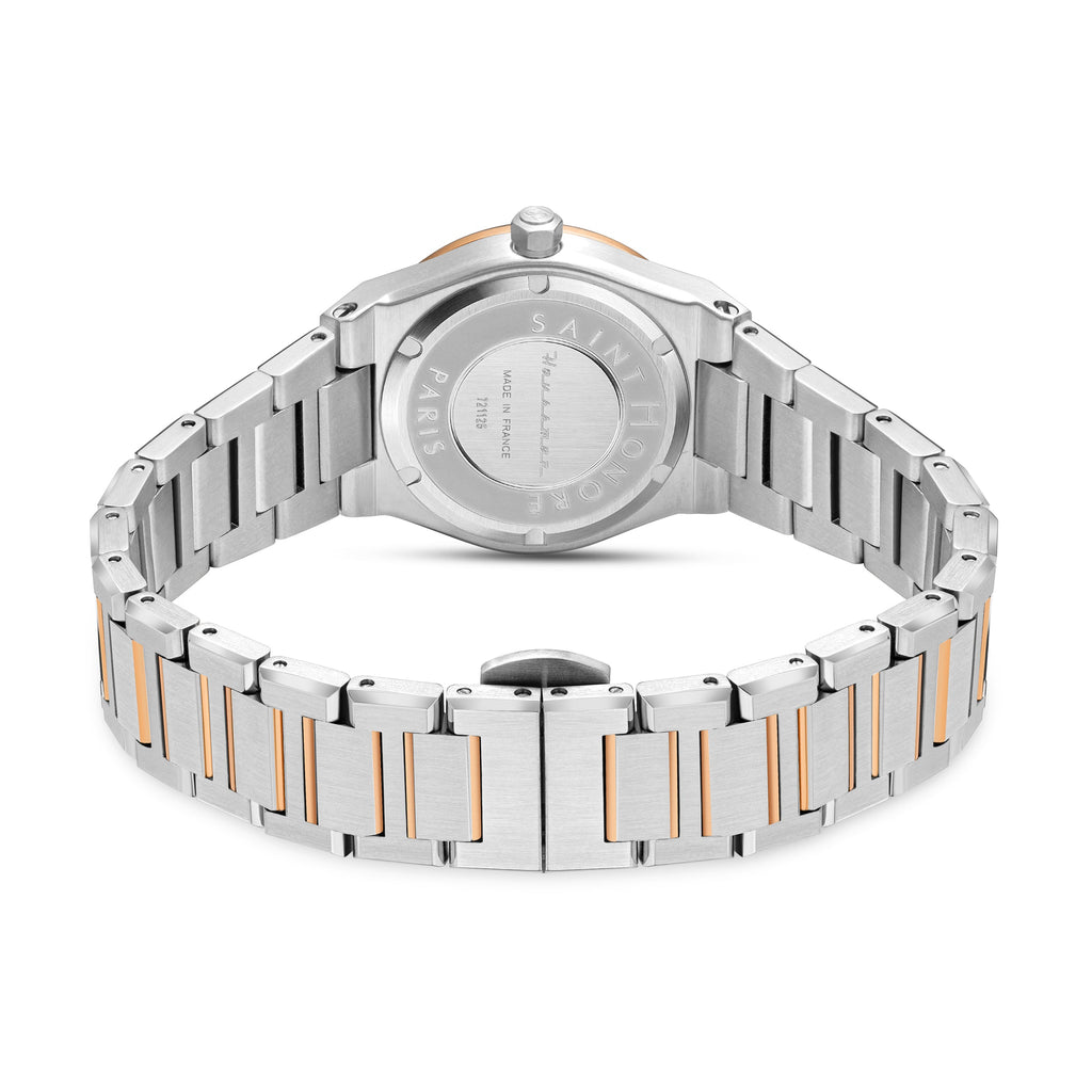 Back of a silver-toned watch with a rose gold-toned bezel. The two-tone metal link bracelet has silver-toned outer links and