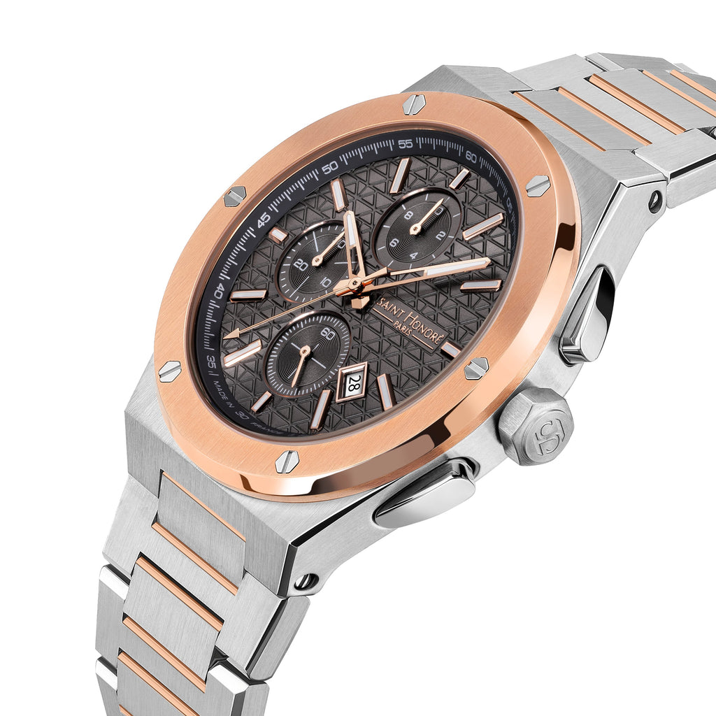 Silver-toned octagonal watch with rose gold-toned bezel, dark gray geometric dial with three subdials, and a two-toned metal