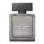 A front-facing view of the Narciso Rodriguez "For Him Musc Santal" fragrance bottle, featuring a minimalist frosted grey glass design with a rectangular silhouette and a dark, wood-textured block cap.