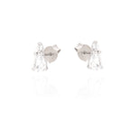 Pair of silver-toned stud earrings, each with a small clear round stone and a larger clear pear-shaped drop stone.