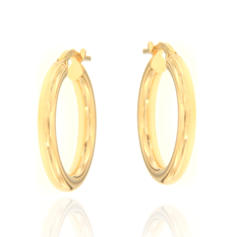 Pair of small, round, polished gold-toned hoop earrings with hinged closures.