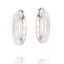 Pair of chunky, tubular silver-toned hoop earrings with a smooth, slightly matte finish and hinged post closures.