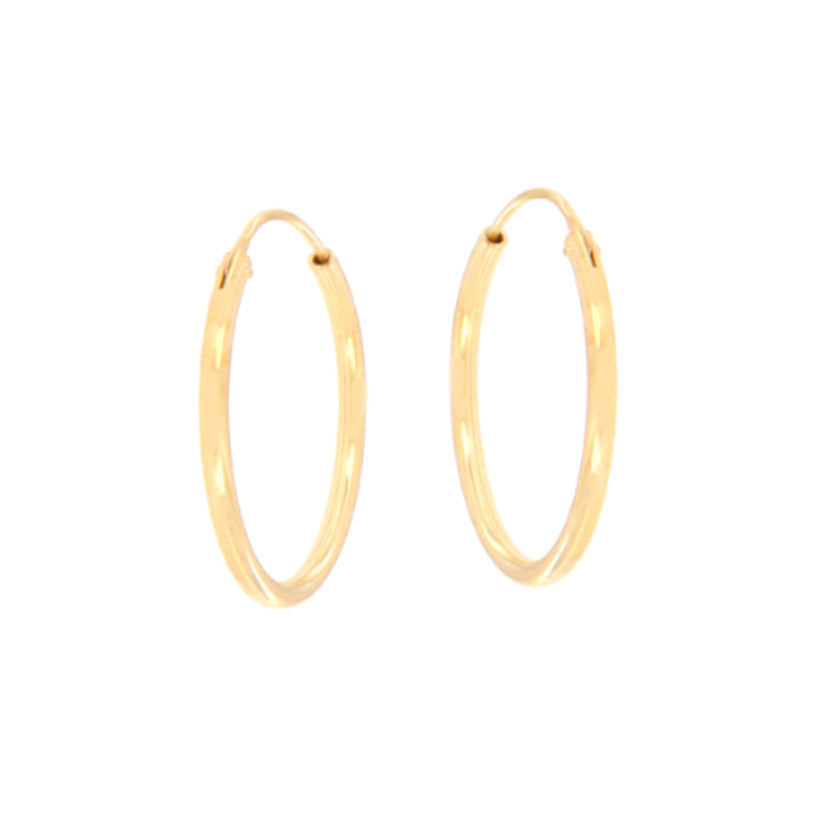 Pair of tiny gold-toned circular hoop earrings with a polished finish.