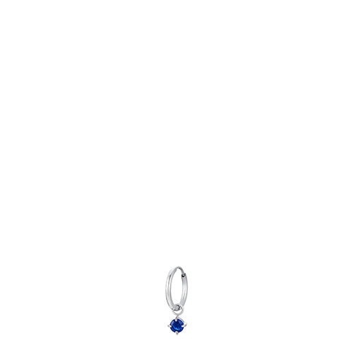Silver-toned steel hoop earring with a dangling round blue zircon in a silver-toned setting.