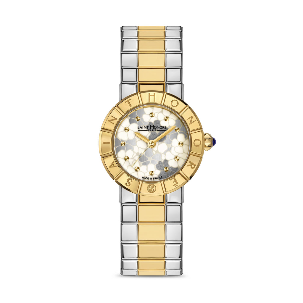 Saint Honore women's watch with a round gold-toned case, white floral patterned dial, and two-tone gold and silver link brace