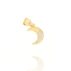 Gold-toned crescent moon charm with a smooth outer curve and an inner curve encrusted with small, clear round stones.
