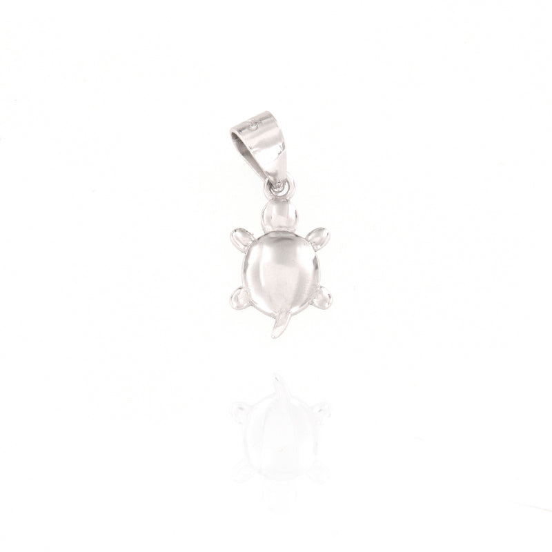 Small silver-toned turtle charm pendant with a polished finish and an integrated bail for attachment.