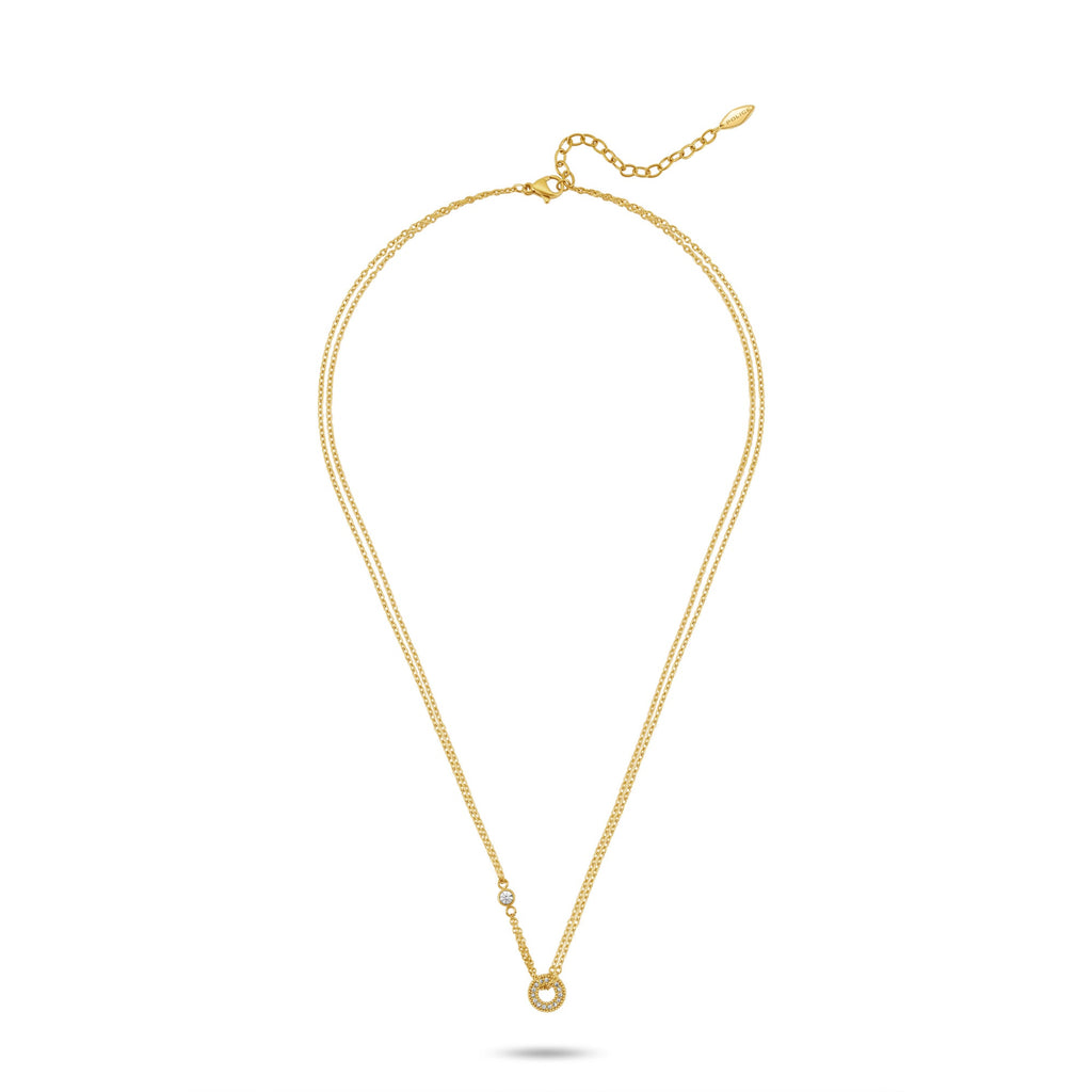 Gold-toned duochain necklace with a small clear crystal on one chain and a crystal-encrusted open circle pendant.