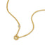 Gold-toned duochain necklace with a circular pendant featuring clear crystals forming the letter 'P', and a single clear crys