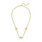 Gold-toned paperclip chain necklace with three clover charms, a lobster clasp, and an extender chain.
