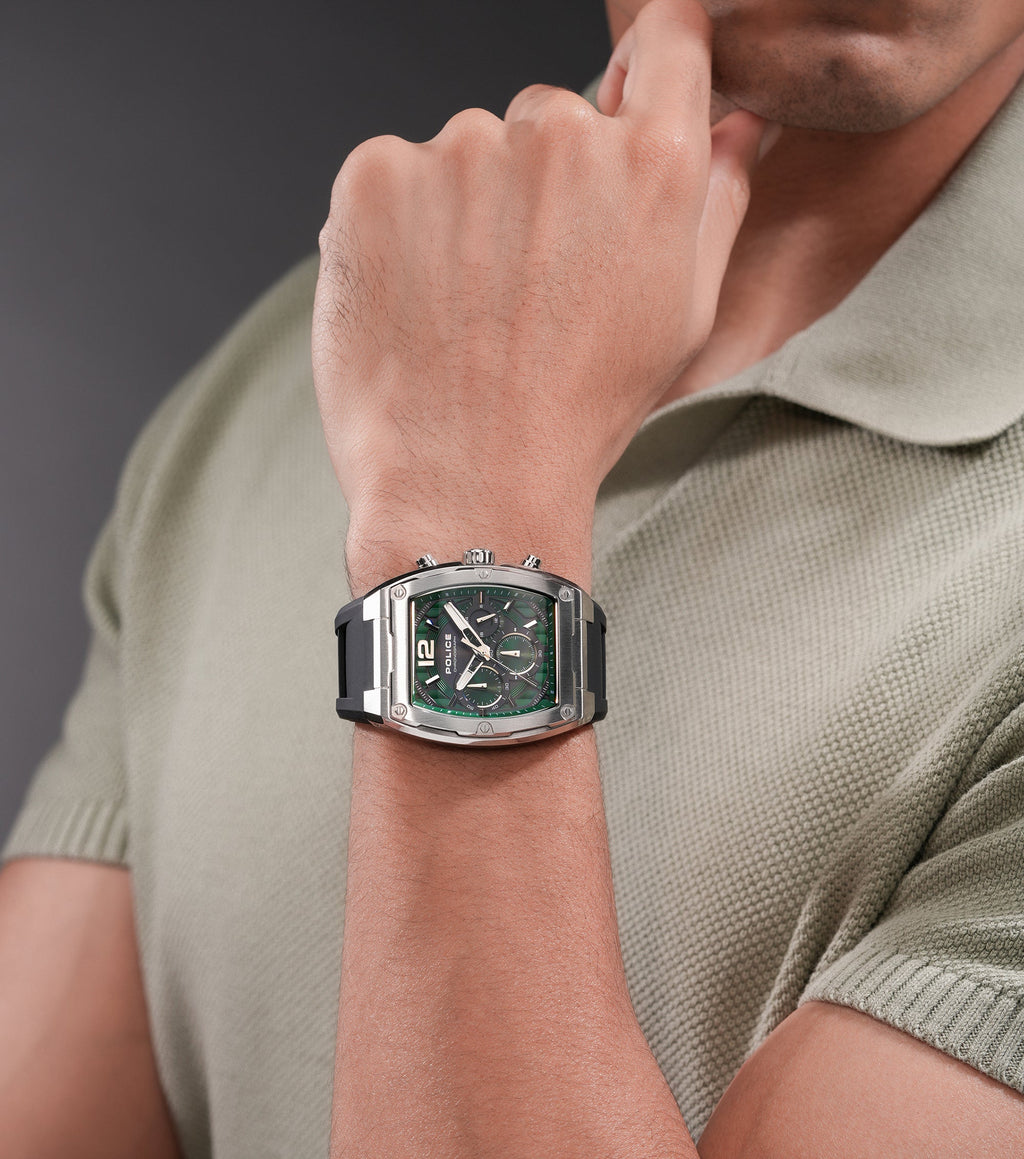 Rectangular silver-toned stainless steel watch with a textured green dial, white markers, three subdials, and a black silicon