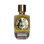 Rectangular faceted glass perfume bottle with yellowish-green liquid, a gold-toned cap, and an ornate black and cream monogra
