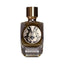 Clear glass perfume bottle with dark amber liquid, gold-toned cap, and a black and cream ornate 'M' logo label. Text 'Incense