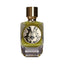 Rectangular glass perfume bottle with yellowish-green liquid, gold-toned cap, and a circular black and cream ornate 'M' emble