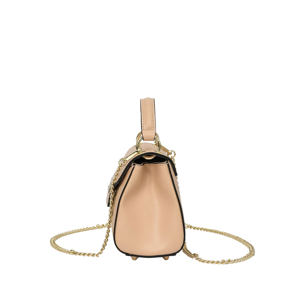 Light peach structured leather top-handle bag with a gold-toned chain strap, dark finished edges, and small feet.